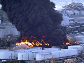 Firefighters battle a petrochemical fire at the Intercontinental Terminals Company Monday, March 18, 2019, in Deer Park, Texas. (AP Photo/David J. Phillip)