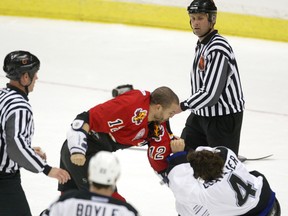 Calgary-05/29/04-Calgary Flames Jarome Iginla wrestles Tampa Bay Lightning's Vincent Lecavalier to the ground in the first period of NHL playoff action at the Saddledome Saturday.  Grant Black/Calgary Herald DATE PUBLISHED MAY 30, 2004 PAGE AA4 (EARLY) * Calgary Herald Merlin Archive *