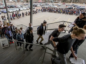 Thousands stream into the Youth Hiring Fair at the Big Four Building in Calgary on March 28, 2017.