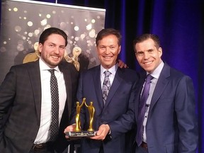 Vice-president of sales and marketing Brayden Logel, president Tim Logel, and area sales manager Brad Logel celebrate their fourth consecutive win at the HOME Awards.