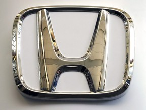 In this Feb. 14, 2019, photo, this photo shows the Honda logo on a sign at the 2019 Pittsburgh International Auto Show in Pittsburgh.