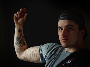 Humboldt Broncos hockey player Ryan Straschnitzki shows his unfinished memorial tattoo.
