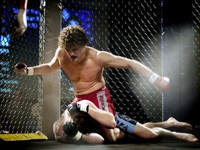 In this Feb. 7, 2009, file photo, Ben Askren pummels Josh Flowers during Askren’s first MMA fight, in Columbia, Mo. Askren is finally making his UFC debut after a decade in mixed martial arts and a lifetime of wrestling. (Parker Eshelman/Columbia Daily Tribune via AP, File)