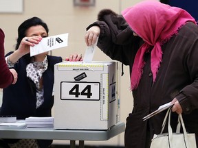 Voters in Calgary-Mountain View cast their ballots at Langevin School on election day, Tuesday, April 16, 2019.