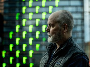 Artist Doug Coupland with his Northern Lights on the TELUS Sky building in Calgary, Ab., on Thursday April 18, 2019. Mike Drew/Postmedia