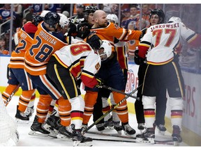 Zack Kassian (#44 centre) and the Edmonton Oilers battle the Calgary Flames during third period NHL action at Rogers Place, in Edmonton Saturday Jan. 19, 2019. Calgary won 5-2. Photo by David Bloom