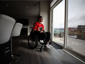 Injured Humboldt Broncos player Ryan Straschnitzki checks out the view from his family's home in Airdrie on April 27, 2019. After several months of renovations to the house Ryan and his family were able to move back in. Photo by Leah Hennel
