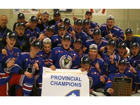 The Calgary Buffaloes celebrate winning Alberta's AAA Midget Hockey League crown as they defeat the St. Albert Raiders 7-4 in game #3 of a the best-of-five AMHL championship series. Tuesday, March 26, 2019. Brendan Miller/Postmedia