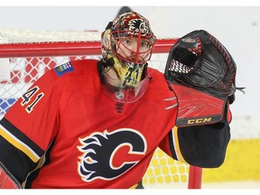 Calgary Flames goalie Mike Smith makes a save on a shot by Los Angeles Kings during NHL hockey at the Scotiabank Saddledome in Calgary on Monday, March 25, 2019. Al Charest/Postmedia