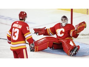 Calgary Flames goaltender Mike Smith reacts after makes a save on a shot by Connor McDavid of the Edmonton Oilers during NHL hockey at the Scotiabank Saddledome in Calgary on Saturday, April 6, 2019. Al Charest/Postmedia