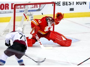 Colorado Avalanche Nathan MacKinnon with overtime winner against Mike Smith of the Calgary Flames in game two of the Western Conference First Round during the 2019 NHL Stanley Cup Playoffs at the Scotiabank Saddledome in Calgary on Saturday, April 13, 2019. Al Charest/Postmedia