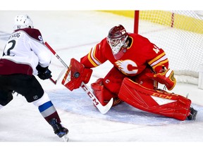 Calgary Flames goalie Mike Smith makes a save on a shot by Gabriel Landeskog of the Colorado Avalanche in game two of the Western Conference First Round during the 2019 NHL Stanley Cup Playoffs at the Scotiabank Saddledome in Calgary on Saturday, April 13, 2019. Al Charest/Postmedia