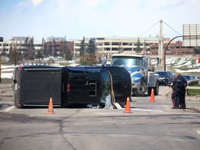 A truck sits on its side after a collision on westbound 16th Avenue and Deerfoot Trail N.E. on Monday, April 29, 2019.