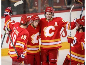 Calgary Flames Johnny Gaudreau celebrates with teammates after scoring against the New York Rangers in NHL hockey at the Scotiabank Saddledome in Calgary on Friday, March 15, 2019. Al Charest/Postmedia