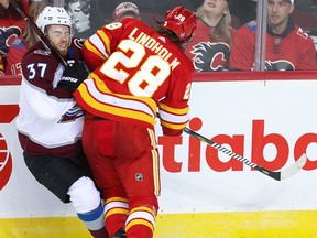 Calgary Flames Elias Lindholm collides with J. T. Compher of the Colorado Avalanche in Game One of the Western Conference First Round during the 2019 NHL Stanley Cup Playoffs at the Scotiabank Saddledome in Calgary on Thursday, April 11, 2019. Al Charest/Postmedia