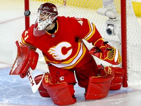 Flames goalie Mike Smith makes a save on Saturday.