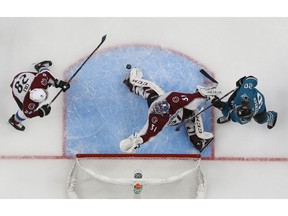Colorado Avalanche's Ian Cole (28) and goaltender Philipp Grubauer (31) make a save against the San Jose Sharks' Marcus Sorensen (20) in the second period of Game 1 of an NHL hockey second-round playoff series at the SAP Center in San Jose, Calif., on Friday, April 26, 2019.