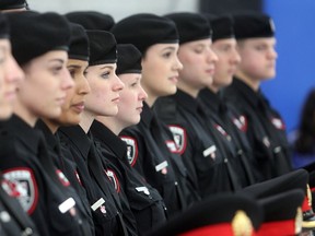Up to 50 cadets could be in the auxiliary program at a time, giving cadets 'the opportunity to work alongside police officers and our civilian staff to learn valuable skills, gain work experience and get first-hand insights into policing,' the service's website reads. Graduating class members of the Calgary Police Auxilliary Cadets program await their group photo at HMS Tecumseh Friday June 12, 2015.