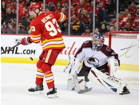 The Calgary Flames' Sam Bennett juggles the puck in a scoring chance against Colorado Avalanche goaltender Philipp Grubauer during game two Stanley Cup playoff action in Calgary on Saturday April 13, 2019. Gavin Young/Postmedia