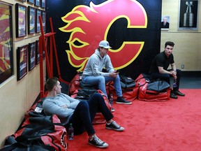 Calgary Flames Michael Stone, Noah Hanifin and Garnet Hathaway relax with some of their gear as the team cleaned out their lockers on Monday April 22, 2019, following the teams early exit from the Stanley Cup playoffs.  Gavin Young/Postmedia