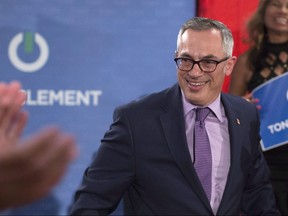 Conservative MP Tony Clement is applauded by supporters as he holds a rally in Mississauga, Ontario to announce his candidacy for the leadership of the Federal Conservative Party on July 12, 2016. THE CANADIAN PRESS/Chris Young