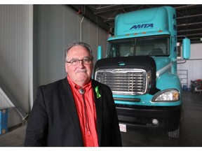 Alberta Transportation Minister Brian Mason stands in front of a training cab at the Alberta Motor Transport Association in Calgary on Tuesday, July 10, 2018. Mason and a group of industry professional will launch constulations for new safety initiatives for the commercial trucking industry, as well as changes to th overall driver road test model. Jim Wells/Postmedia