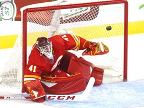 Flames goalie Mike Smith makes a save and watches a rebound during game five between the Colorado Avalanche and Calgary Flames in Calgary on Friday, April 19, 2019. Jim Wells/Postmedia