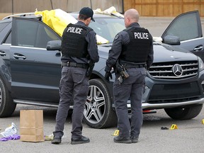 Calgary police investigate after two people were killed in a parking lot at 37th ave. and Barlow Trail N.E. early Wednesday morning in Calgary on Wednesday, April 3, 2019.