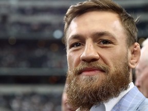 Conor McGregor is seen on the sidelines before the NFL game between the Jacksonville Jaguars and Dallas Cowboys at AT&T Stadium on Oct. 14, 2018 in Arlington, Texas. (Ronald Martinez/Getty Images)