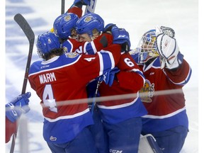 The Edmonton Oil Kings celebrate a 2-1 overtime win over the Hitmen in Calgary on Tuesday night.