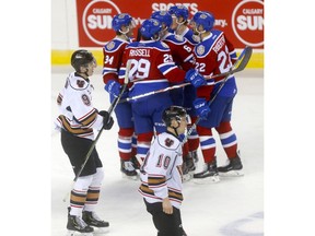 Calgary Hitmen players react after the Edmonton Oil Kings scored their fifth goal -- this one by Wyatt McLeod -- in second period WHL Eastern Conference Semi-Final action at the Scotiabank Saddledome in Calgary on Wednesday. Photo by Darren Makowichuk/Postmedia.
