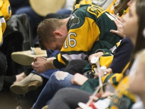 Family members and friends look on during the Humboldt Broncos memorial service at Elgar Petersen Arena in Humboldt, Saskatchewan on Saturday, April, 6, 2019. One year ago today, sixteen people were killed and 13 were injured after the Saskatchewan hockey team's bus collided with a semi driven by a novice trucker who had blown the stop sign at a rural intersection.THE CANADIAN PRESS/POOL-Liam Richards ORG XMIT: CPT715