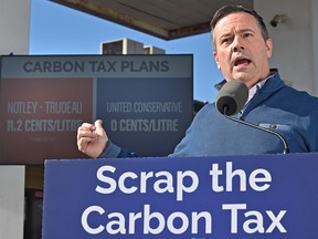 United Conservative Leader Jason Kenney respond to the federal carbon tax, which takes effect Monday during a news conference at the Lymburn Esso in west Edmonton, April 1, 2019. Ed Kaiser/Postmedia