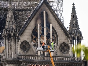 Workers intervene on the northern side of Notre-Dame Cathedral in Paris on April 18, 2019, three days after a fire devastated the landmark in the centre of the French capital. (BERTRAND GUAY/AFP/Getty Images)