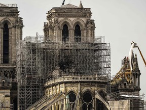 Worker on Notre Dame Cathedral in Paris on April 17, 2019, three days after a fire that devastated the building in the centre of the French capital.