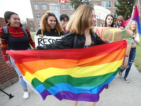 Students at Western Canada High School in downtown Calgary walk out of class during a  show of support for GSAs on Friday, May 3, 2019.