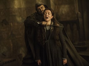 This image released by HBO shows Michelle Fairley portraying Catelyn Stark in a scene from "Game of Thrones." (HBO via AP)