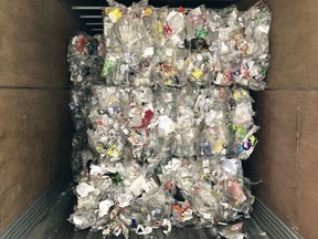 Clamshell plastic packaging collected by Calgary's blue cart program is stockpiled at Shepard Landfill. Last year, the city spent  nearly $300,000 to store the hard-to-recycle material.