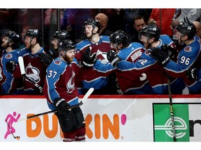 Avalanche forward J.T. Compher is congratulated by teammates after scoring a goal against the San Jose Sharks in the third period during Game 6 of the Western Conference Second Round during the 2019 NHL Stanley Cup Playoffs at Pepsi Center in Denver on Monday night.