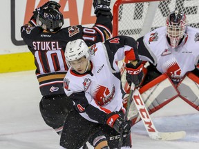 Jett Woo of the Moose Jaw Warriors in action against the Calgary Hitmen on Oct. 16, 2016. Woo has been acquired by the Hitmen in a blockbuster trade.
