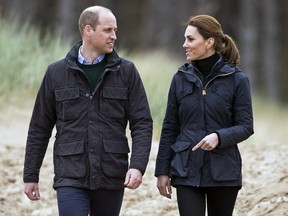 Prince William and Kate, Duchess of Cambridge smile during a visit to Newborough Beach in North Wales, Wednesday, May 8, 2019. (Aaron Chown/PA via AP)