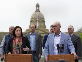 Lakeland MP Shannon Stubbs, front left, and Medicine Hat-Cardston-Warner MP Glen Motz, front right, with Fort Macleod community crime prevention committee member Conrad Van Hierden, Red Deer-Mountain View MP Arnold Viersen, Red Deer-Lacombe MP Blaine Calkins and Peace River-Westlock MP Earl Dreeshen at a news conference on the recently tabled report on rural crime in Edmonton on Thursday, May 23, 2019.