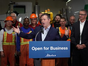 Alberta Premier Jason Kenney (middle) and Alberta Finance Minister Travis Toews (right) announced at Lafarge Infrastructure in Edmonton on Monday May 13, 2019 that their government plans to create jobs in the province by having the lowest corporate business tax rate in Canada.
