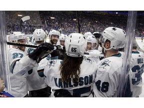 San Jose Sharks defenceman Erik Karlsson, of Sweden, is congratulated after scoring the winning goal against the St. Louis Blues during overtime in Game 3 of the NHL hockey Stanley Cup Western Conference final series Wednesday in St. Louis. The Sharks won 5-4 to take a 2-1 lead in the series.