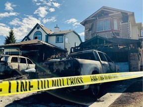 Three homes and multiple vehicles in the northwest Calgary community of Arbour Lake were damaged during an early morning fire on May 12, 2019. Gavin Young / Postmedia Network