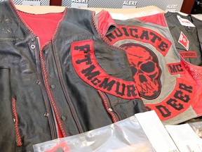 Drugs, weapons, cash and biker paraphanalia are shown in an image supplied to media by Albert Law Enforcement Response Team on Friday, May 3, 2019. Members of a Red Deer outlaw motorcycle club have been charged with drug trafficking offences.