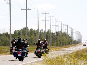 Bikers arrive at the Hells Angels clubhouse in southeast Calgary on July 22, 2017. Police have made a drug bust in Red Deer, charging two people with links to the Hells Angels.