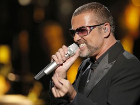 FILE - In this Sept. 9, 2012 file photo, British singer George Michael sings in concert to raise money for AIDS charity Sidaction, in Paris, France.