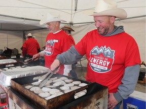 Breakfast sausages cook on the grill during the 2019 Grey Cup Kickoff Breakfast in Calgary's Olympic Plaza on Tuesday May 7, 2019.