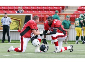 Then with Crescent Heights, OL Shane Richards (at right) chats with South teammate Michael Annuik of Bishop Grandin at the high school football provincial all-star game at McMahon Stadium in this file photo from 2013. Postmedia file photo.